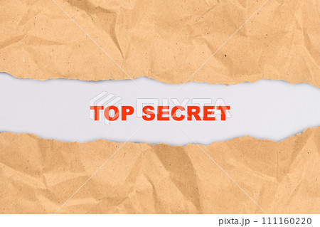 Ripped paper with text of top secret 111160220