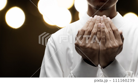 Muslim man raised her hands and prayed to Allah 111160239