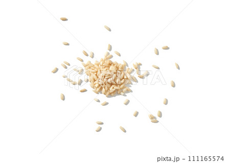 A top view of raw brown and white rice, forming a heap. The integral, uncooked 111165574