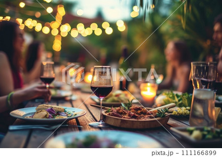 Happy friends having fun outdoor. Group of friends having backyard dinner party Happy friends having fun outdoor. Group of friends having backyard dinner party 111166899