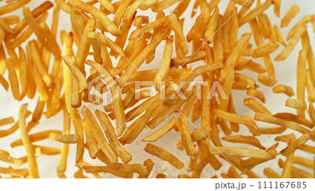 Flying French Fries up in the Air. Fast Food Concept with Flying Food. Flying French Fries up in the Air. Fast Food Concept with Flying Food. 111167685
