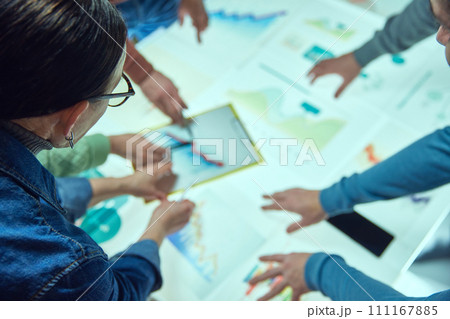 Project managers looking on digital screen, checking analytical documents, working with graph. Finance management Project managers looking on digital screen, checking analytical documents, working with graph. Finance management 111167885