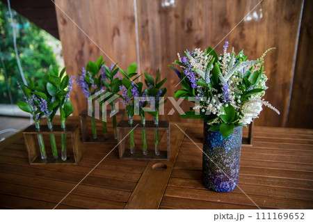 decor of flowers on a table in a restaurant 111169652