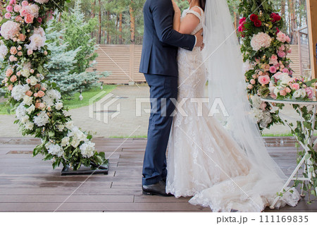 bride and groom at a wedding ceremony bride and groom at a wedding ceremony 111169835