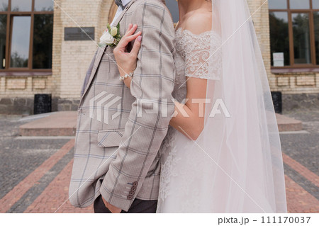 bride and groom in summer park together 111170037