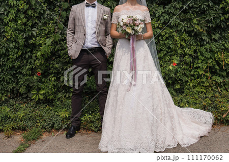 bride and groom in summer park together 111170062