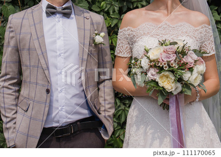 bride and groom in summer park together 111170065