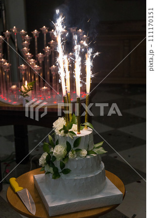 bride and groom cut a wedding cake 111170151