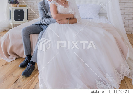 bride and groom in a room together bride and groom in a room together 111170421