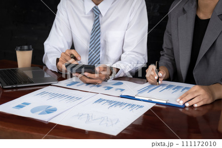 businessmen and businesswomen team meeting to plan strategies to increase business income. Have a brainstorming graph analysis and discussing for the new target success 111172010