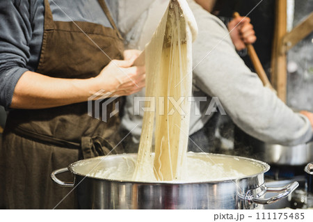 Baker kneads dough on the market 111175485