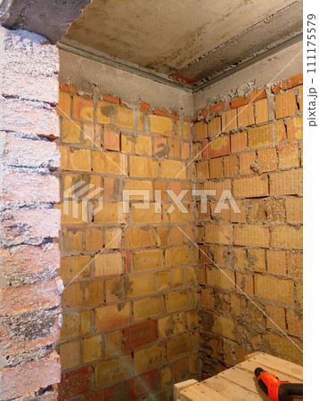 repair in a brick building at a construction site 111175579