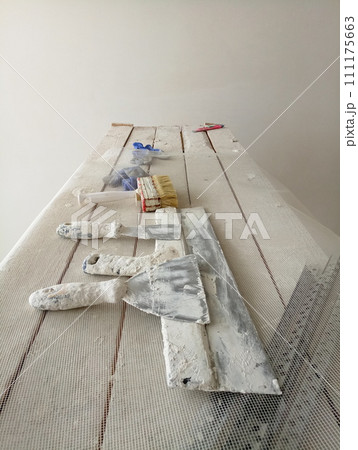 spatula for painters on a wooden chair spatula for painters on a wooden chair 111175663