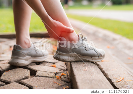 Relieve pain and discomfort for female joggers after running. Specialized care for ankle injuries. Get back on track with treatment concept. Relieve pain and discomfort for female joggers after running. Specialized care for ankle injuries. Get back on track with treatment concept. 111176025
