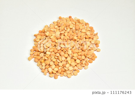 Peeled and dried peas on a white background. Peeled and dried peas on a white background. 111176243