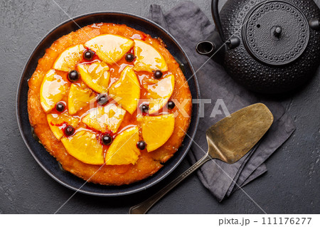 Sweet cake with orange slices and berries Sweet cake with orange slices and berries 111176277