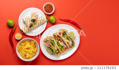 Mexican food featuring tacos, burritos, nachos, burgers 111176283