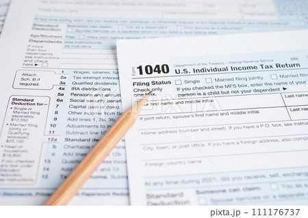 Tax form 1040 U.S. Individual Income Tax Return, business finance concept. Tax form 1040 U.S. Individual Income Tax Return, business finance concept. 111176737