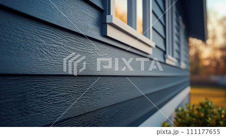 Blue vinyl siding texture and window, close-up view. Blue vinyl siding texture and window, close-up view. 111177655