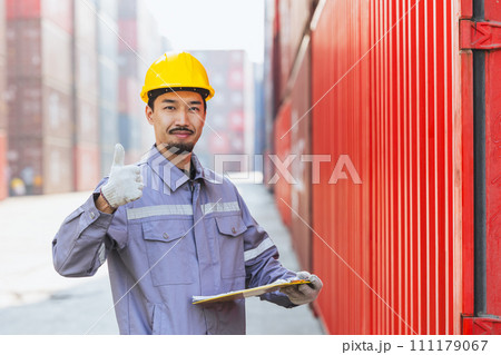 Portrait happy Japanese male engineer worker working in container port cargo. Japan shipping logistics industry customs staff people. Portrait happy Japanese male engineer worker working in container port cargo. Japan shipping logistics industry customs staff people. 111179067