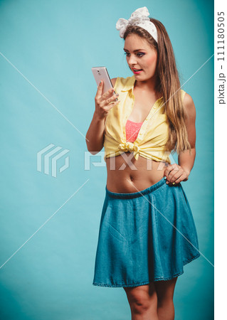 Retro girl looking into smartphone. Retro girl looking into smartphone. 111180505