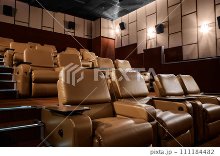 VIP place for visitors of cinema with leather armchair seats VIP place for visitors of cinema with leather armchair seats 111184482