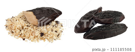 Tonka bean isolated on white background with full depth of field. Bean of Dipteryx odorata Tonka bean isolated on white background with full depth of field. Bean of Dipteryx odorata 111185508