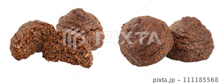 chocolate cookie with kerob, banana, cashew, sunflower seeds and coconut paste isolated on white background. Healthy food, gluten-free, flour-free chocolate cookie with kerob, banana, cashew, sunflower seeds and coconut paste isolated on white background. Healthy food, gluten-free, flour-free 111185568