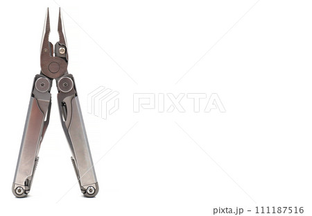 One modern gray iron open folding multifunctional knife isolated on a white background. Multitool with extended tools and pliers. Compact and portable product. Pocket knife. EDC concept 111187516