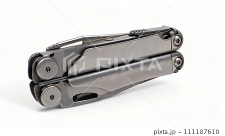 Folded steel multitool isolated on white background. A tool for daily practice. All in one. Construction and repair. Compact and portable product. Pocket knife. EDC concept 111187610