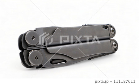 Folded steel multitool isolated on white background. A tool for daily practice. All in one. Construction and repair. Compact and portable product. Pocket knife. EDC concept 111187613
