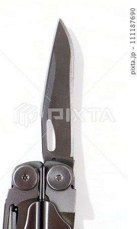A steel multi-tool with an open knife blade lies on a white background. Pocket open folding knife. Portable multitasking multitool with many tools. EDC concept. A tool for daily practice. All in one A steel multi-tool with an open knife blade lies on a white background. Pocket open folding knife. Portable multitasking multitool with many tools. EDC concept. A tool for daily practice. All in one 111187690