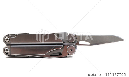 A steel multi-tool with an open knife blade lies on a white background. Pocket open folding knife. Portable multitasking multitool with many tools. EDC concept. A tool for daily practice. All in one A steel multi-tool with an open knife blade lies on a white background. Pocket open folding knife. Portable multitasking multitool with many tools. EDC concept. A tool for daily practice. All in one 111187706