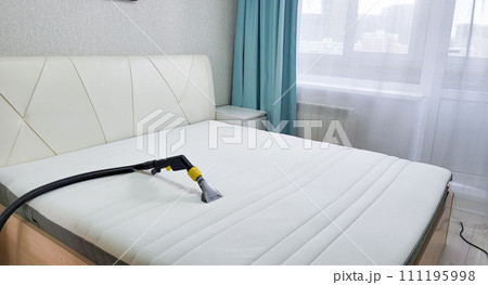 Mattress dry cleaning using a professional machine and chemicals. Dry cleaning at home. Mattress dry cleaning using a professional machine and chemicals. Dry cleaning at home. 111195998