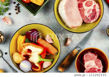 Fresh meat and raw vegetables. 111202335