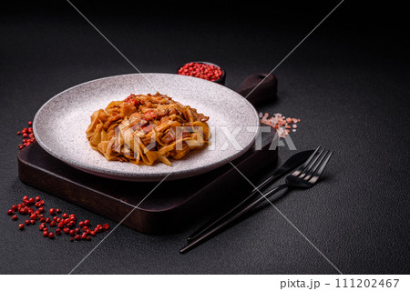 Delicious asian udon dish with vegetables, mushrooms, salt and spices Delicious asian udon dish with vegetables, mushrooms, salt and spices 111202467