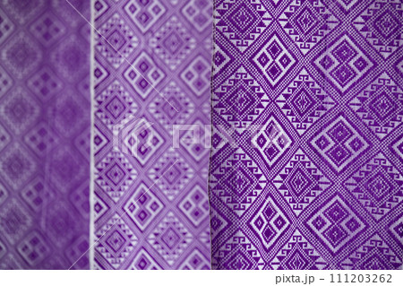 Indego Tai Lue woven fabric from northern of Thailand. (Selective focus). Indego Tai Lue woven fabric from northern of Thailand. (Selective focus). 111203262