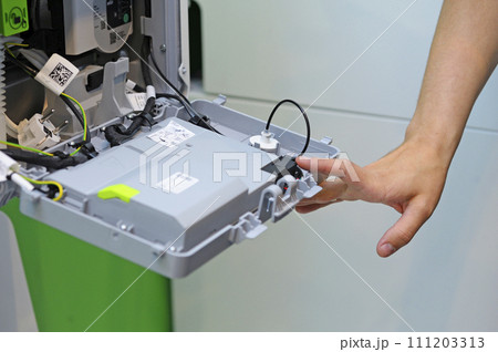 Man fitter assembling modern house gas boiler 111203313