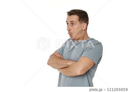 surprised guy looking at camera on white studio background surprised guy looking at camera on white studio background 111203859