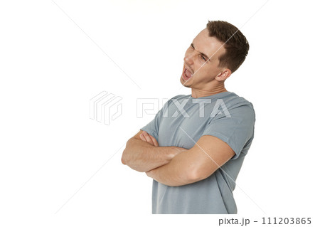 portrait of young happy man winking looking at the camera on white background 111203865
