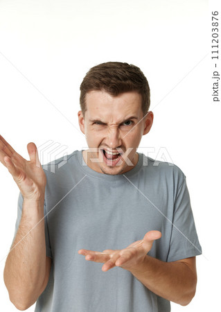 annoyed angry man shouting on white studio background annoyed angry man shouting on white studio background 111203876