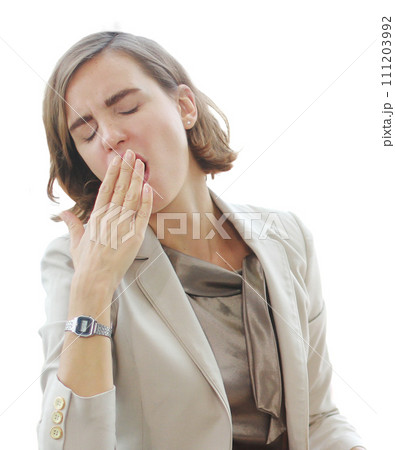 Businesswoman in white suit so Bored and yawning at office computer desk in workplace 111203992