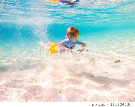 Child snorkeling. Kids underwater. Beach and sea. Child snorkeling. Kids underwater. Beach and sea. 111204336