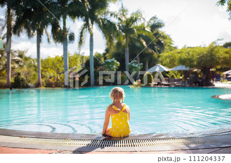 Child in swimming pool. Kids swim. Water play. Child in swimming pool. Kids swim. Water play. 111204337