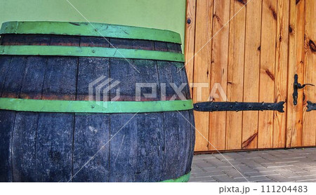 Old rustic wine barrel. Wine background in Europe. Czech Republic, South Moravia Old rustic wine barrel. Wine background in Europe. Czech Republic, South Moravia 111204483