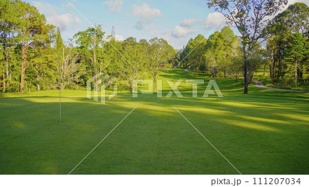 View of golf course with beautiful putting green. 111207034