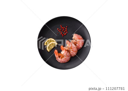 Delicious shrimp or langoustine tails boiled with salt and spices Delicious shrimp or langoustine tails boiled with salt and spices 111207781