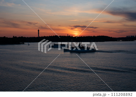 Scenic view of lake against sky at sunset, Nacka, Stockholm,Sweden. Scenic view of lake against sky at sunset, Nacka, Stockholm,Sweden. 111208892