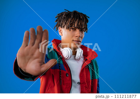 Serious african man showing rejecting gesture by stop palm sign. Dont play me Serious african man showing rejecting gesture by stop palm sign. Dont play me 111211877