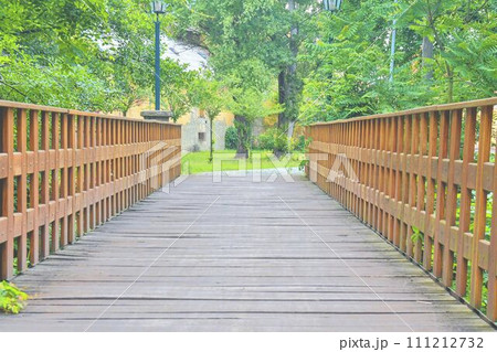 Old wooden bridge in town, natural vintage background 111212732